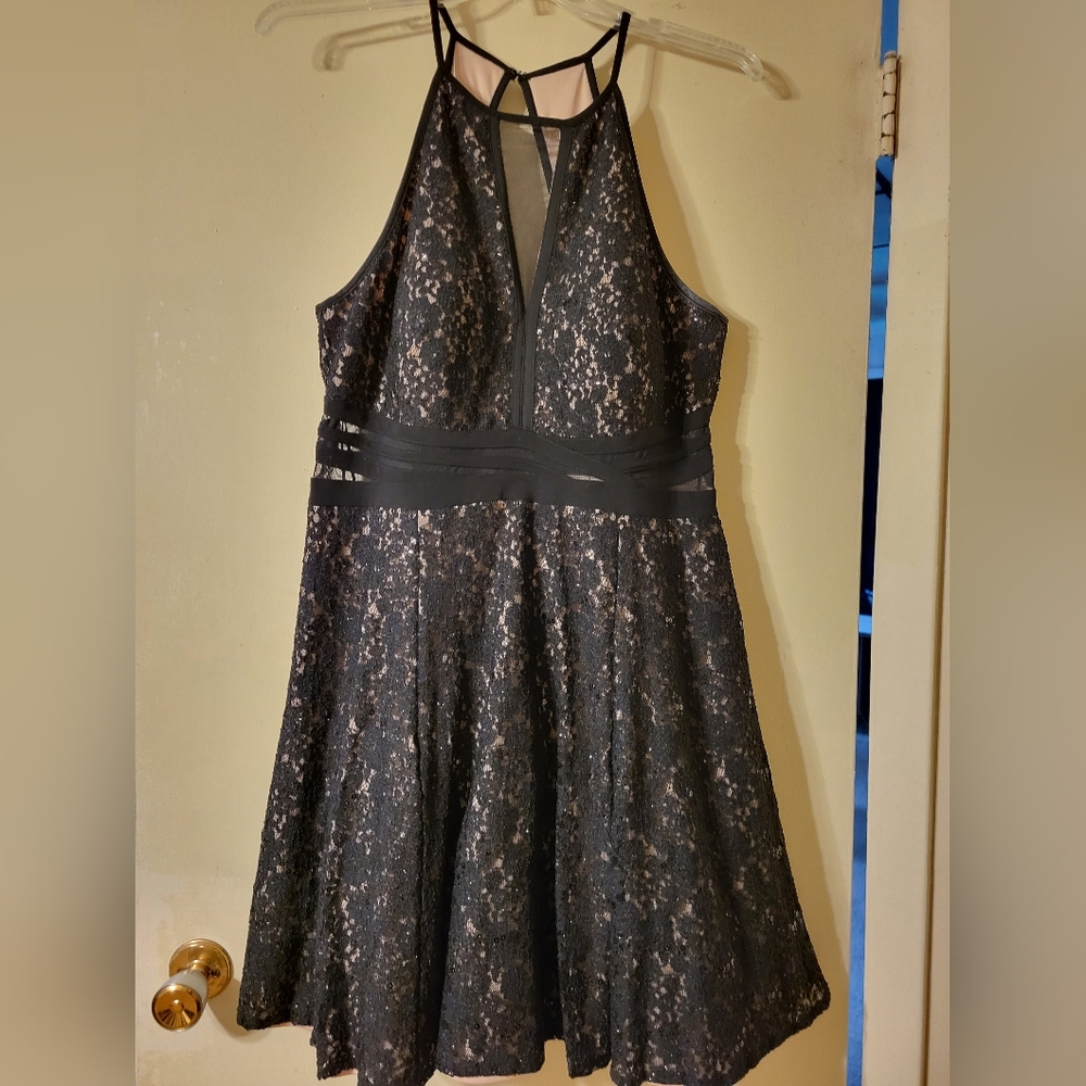Black strapless lightly sequined gown.sheer wai